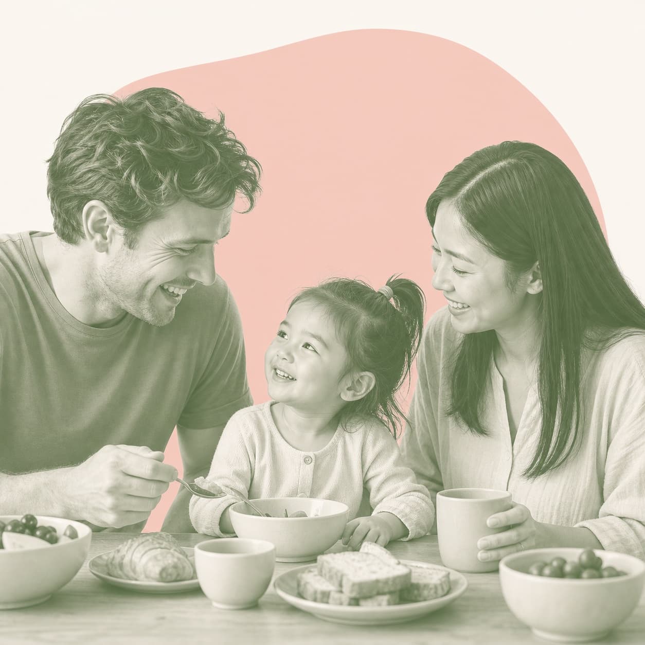 A family of three sharing breakfast together at home