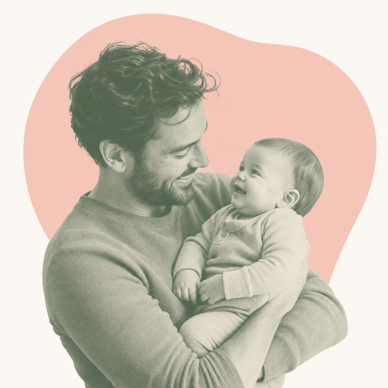 A parent cradling their smiling baby at home